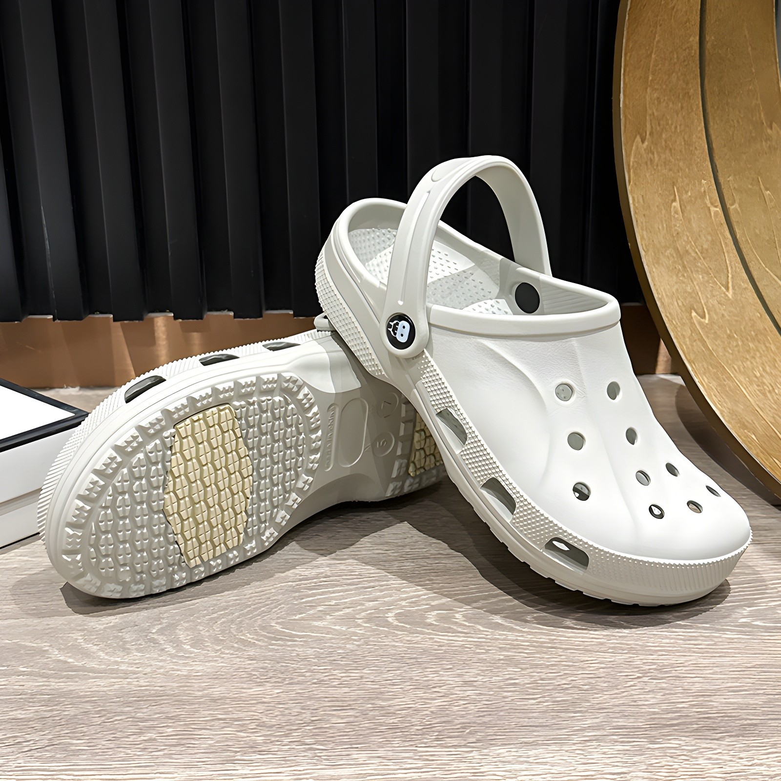 Close-up of white clog highlighting ventilation holes and strap