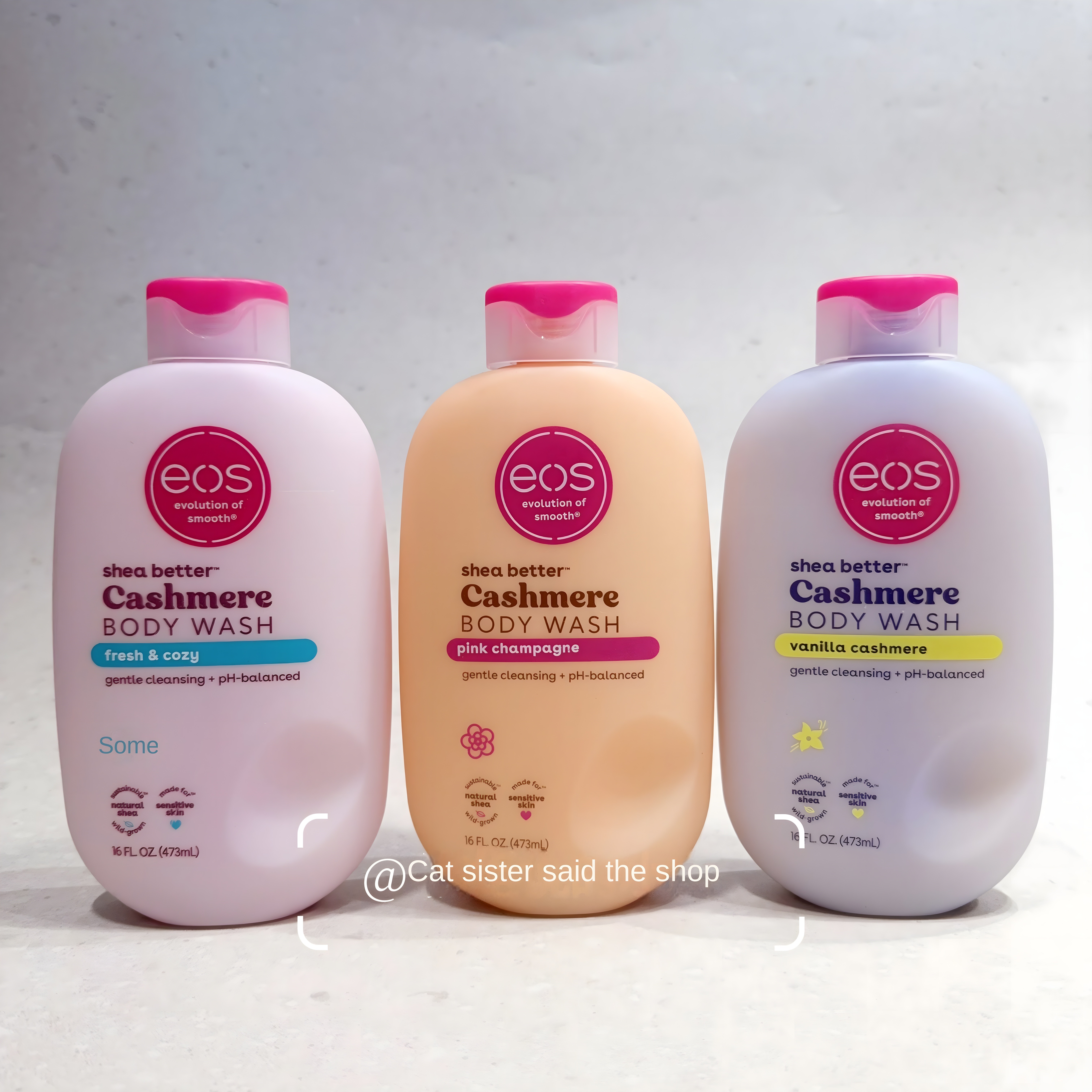 Black and white image of three eos Cashmere Body Wash bottles